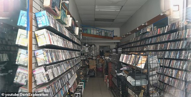 A closed video game store has hundreds of games on its shelves that are slowly becoming outdated