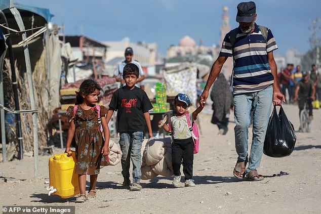 Displaced Palestinians are leaving western Khan Yunis for areas in the eastern parts of the city, following reports of Israeli troops withdrawing from the area on July 30.