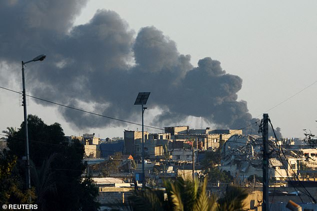 Smoke rises from an Israeli airstrike in Rafah, seen from Khan Younis, in the southern Gaza Strip, on July 29