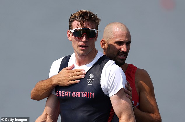 Martin Sinkovic consoled Tom George after Team GB lost their lead in the final metres