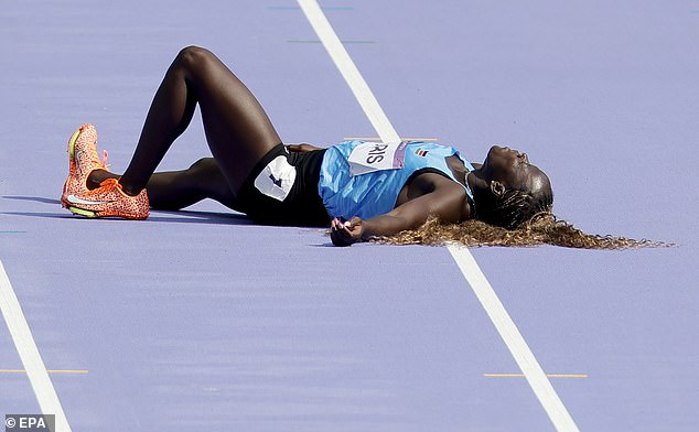 South Sudan's Lucia Moris collapsed to the ground during the preliminary round of the women's 100 meters