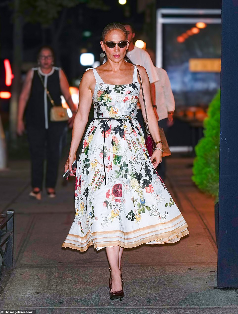 The 55-year-old singer wore a floral print dress, maroon heels and a matching bag with sunglasses as she headed to a preview of Cats in New York City