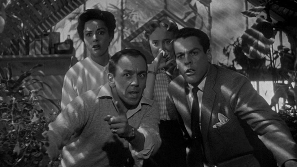 Two men and two women hide in Invasion of the Body Snatchers.