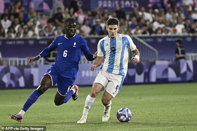 Alvarez (right) pictured in action for Argentina against France during the Olympic Games on Friday night