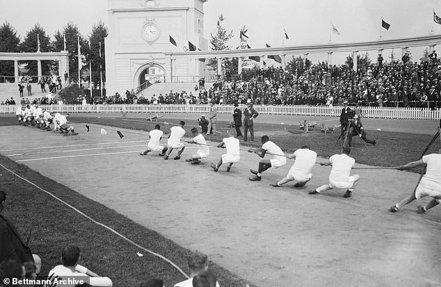 Great Britain defeats the American team in tug of war, during the 1920 Summer Olympics, Antwerp, Belgium. This was the last Olympic Games to feature tug of war