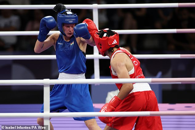 Imane Khelif (right) and Luca Anna Hamori during the women's 66kg quarterfinal at the North Paris Arena today