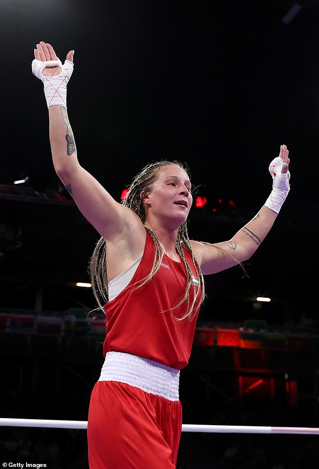 Team Hungary's Anna Luca Hamori (pictured) celebrates her victory in the preliminary round of the women's 66kg event against Marissa Williamson