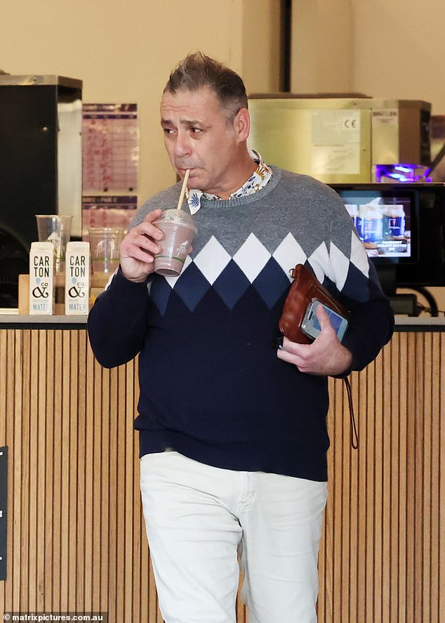 The 52-year-old looked clean-shaven as he stopped at Oak Berry acai bar for a smoothie