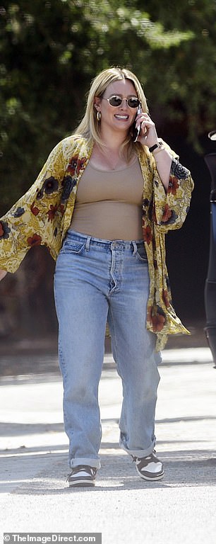 Duff, who gave birth to daughter Townes in May, wrapped herself in the bright LA ​​sunshine in a sheer jacket in gold, red, charcoal and cream