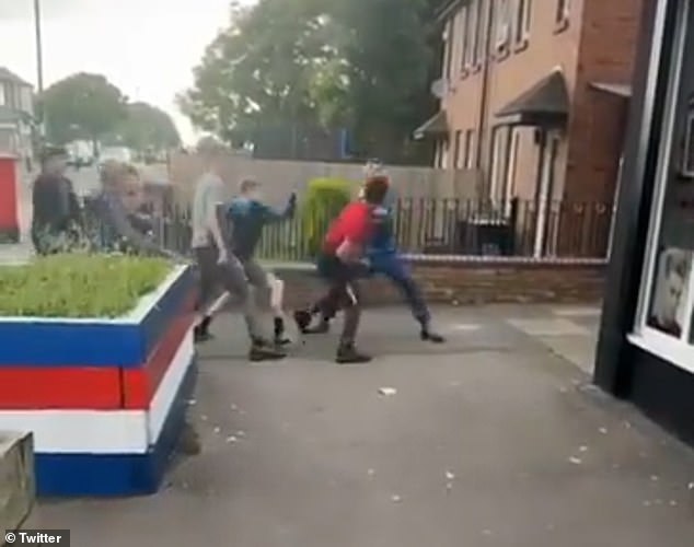 A man in a red shirt continues to exchange blows with a youth in the clip, which was filmed in Cowgate, Newcastle Upon Tyne