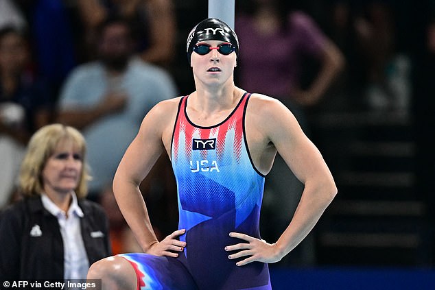 The clip shows Jordan playing peek-a-boo with a young Ledecky in a luxury box at an event