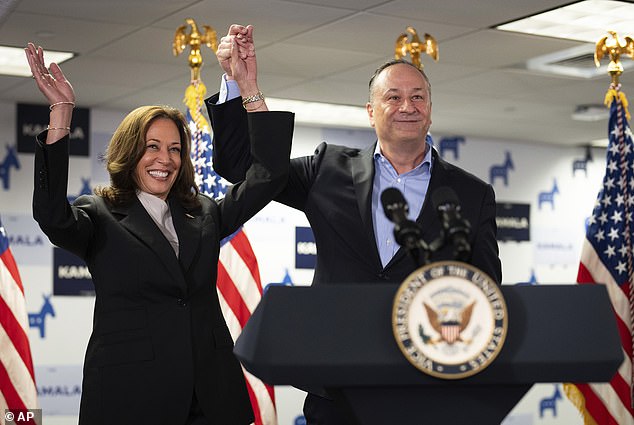 Vice President Kamala Harris, left, and Second Instance Doug Emhoff address their staff at her campaign headquarters in Wilmington, Delaware.