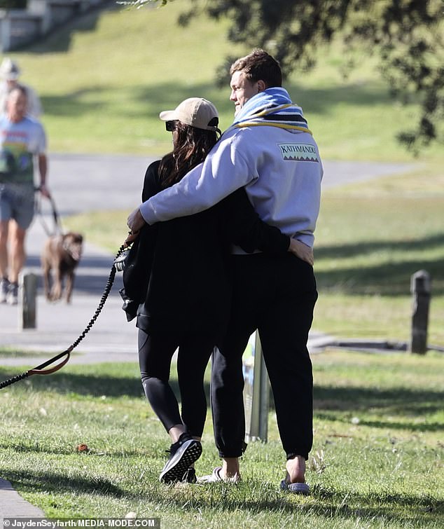 The couple looked like there was nowhere they'd rather be as they strolled through a nearby park