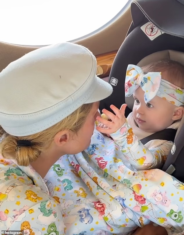 In the clip, the Simple Life alum stands across from her daughter in a car seat, both dressed in matching Care Bears pajamas, with London also wearing a matching bow