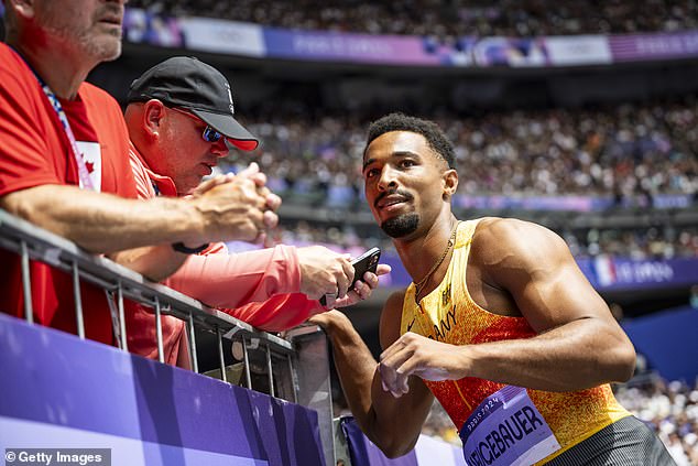 Garnham responded after German Leo Neugebauer became frustrated with his discus throw