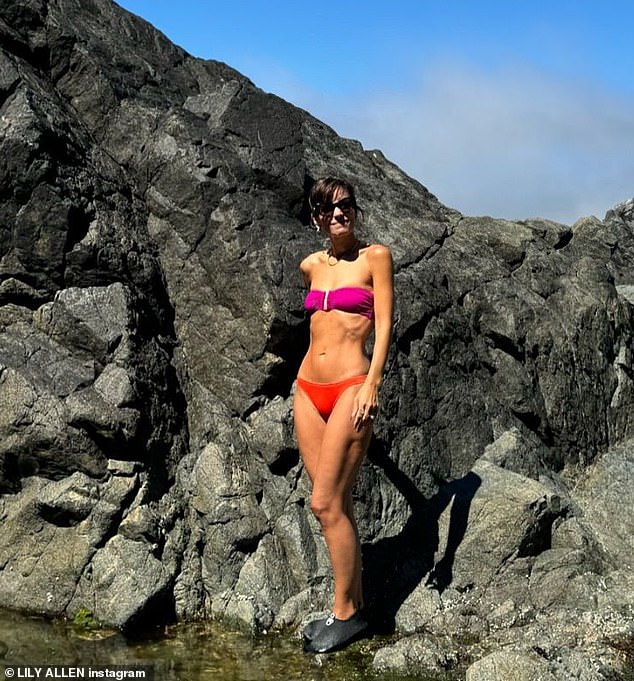 Another showed Lily's tanned skin as she stood on a rock at the water's edge, with a view of the mountains in the background