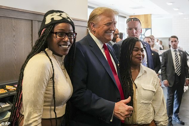 Trump with Michaelah Montgomery (left) at a Chick-fil-A restaurant in Atlanta on April 10