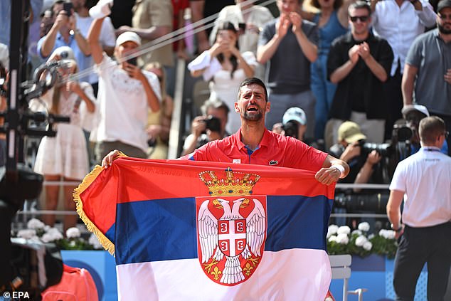 Djokovic was emotional as he held up a Serbian flag after ending his long wait for Olympic gold