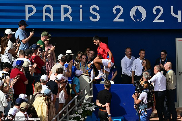 Shortly after the match, Djokovic climbed into the crowd and went straight to his family