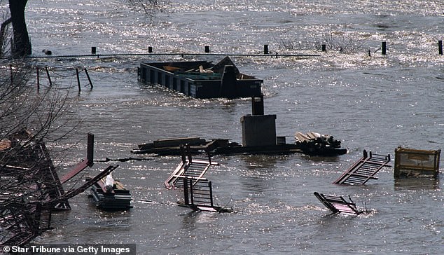 Pictured: Flooding turns roads into rivers in Minneapolis after downpour