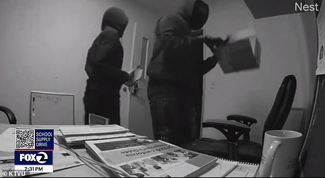 Two masked men ransacked more than a dozen small businesses in the building, stealing an estimated $120,000 worth of items