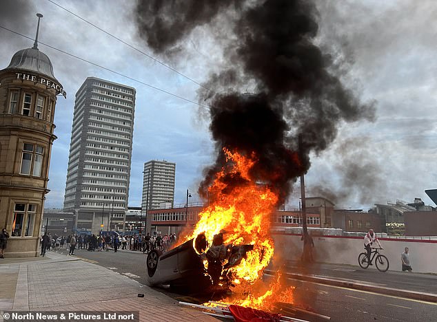 A car on fire in Sunderland. Chaos has engulfed Britain this week, leaving officers broken, cars set alight, shops looted and innocent civilians targeted on the streets