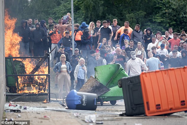 Protesters in Rotherham. Malaysia's Foreign Ministry said: 'Malaysians living in or travelling to the UK are urged to stay away from protest areas, remain vigilant and follow the latest updates and guidance from local authorities'