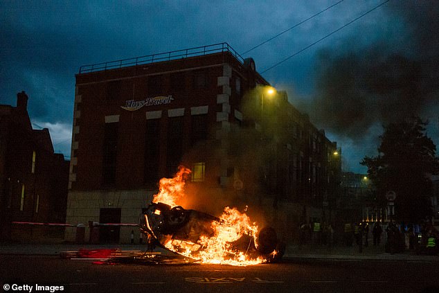 A police car set on fire in Sunderland. As part of the clean-up operation, Northumbria Police are now hunting for those responsible for the widespread destruction and have said those responsible 'can expect to be dealt with to the full force of the law'