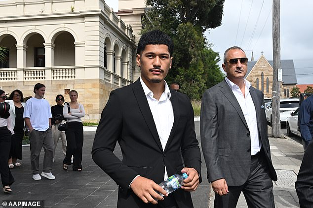 Amone (pictured centre, outside court in December last year) was sentenced to a two-year Intensive Corrections Order for the hammer attack