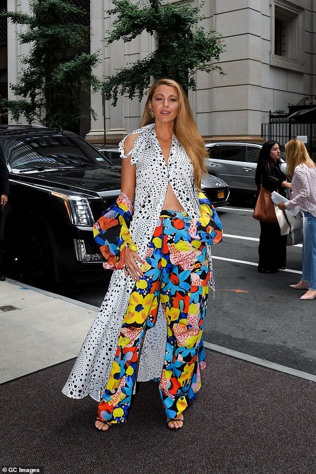 The Rhythm Section actress paired a black and white patterned dress over loose-fitting, multi-colored floral pants and sandals