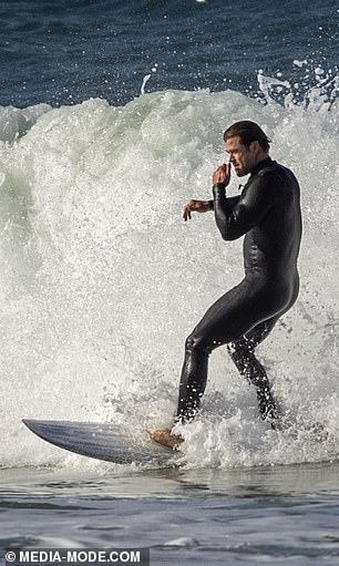 Chris had a look of complete concentration as he donned a wetsuit and jumped into the water