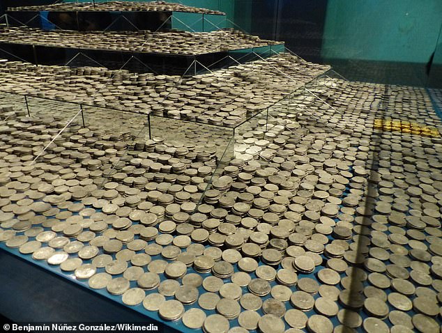 Pictured: The coins Odyssey found aboard the wreck of the 1804 Spanish warship Nuestra Señora de las Mercedes. These coins are on display in a Spanish museum after a long legal battle between Odyssey and the Spanish government over who had the rightful claim