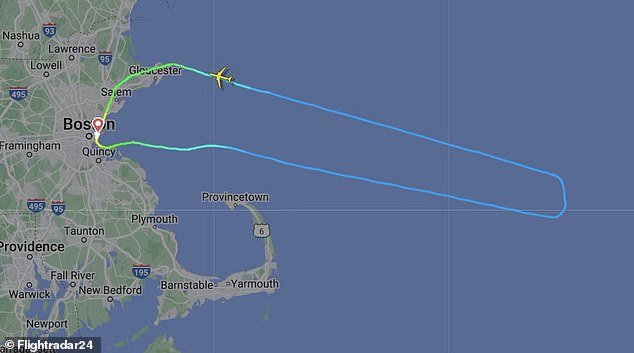 The plane had to turn around over the Atlantic Ocean and land in Boston due to the weather incident