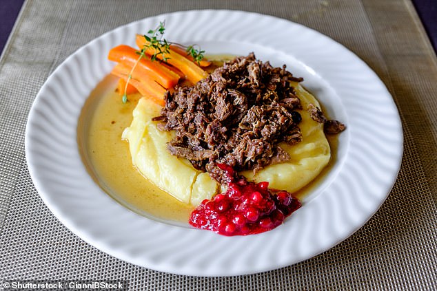 Baked reindeer with lingonberry sauce, pictured above, is a popular Finnish dish and a traveler's favorite (stock image)