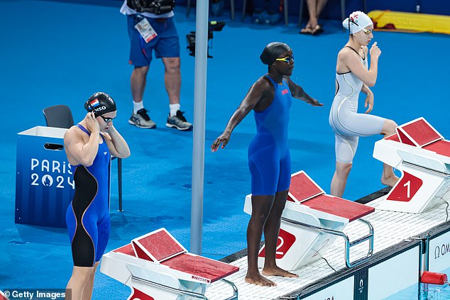 Alonso (pictured left before her race) narrowly missed out on qualifying for the semi-finals of the 100m butterfly