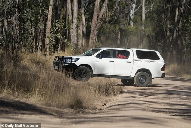 On Thursday morning, a police car loaded with forensic equipment is seen on the estate