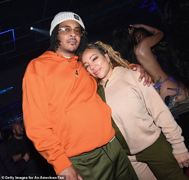 The rapper, 43, was handcuffed after an arrest warrant was reportedly issued for another man named Clifford Harris — which is T.I.'s real name — with the other Harris wanted in Baltimore, Baltimore County, Maryland, according to TMZ — pictured with his wife Tiny Harris in March 2024