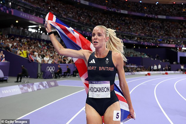 She briefly moved her left hand to cover her face, her eyes beginning to swell, before grabbing a Union flag