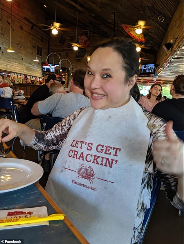 The mother of two smiles for the camera as she enjoys a meal, her social media account reports