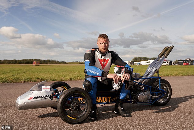 Freddie Flintoff on a motorized tricycle while filming a series of Top Gear