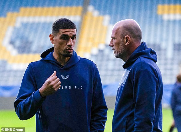 Defender Leon Balogun and Clement discuss tactics at the Lublin Arena