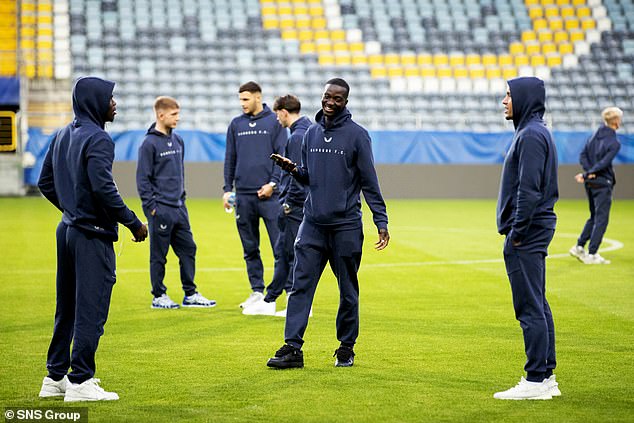 Mohamed Diomande and his Rangers teammates walk around the pitch