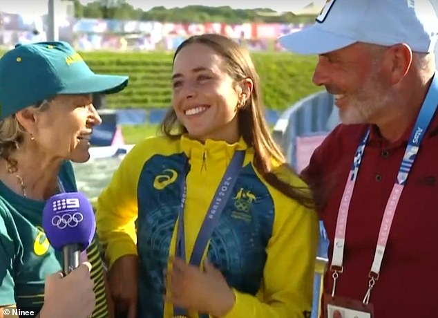 Proud parents Myriam Fox-Jerusalmi and Richard Fox are pictured celebrating with Noemie after her stunning kayak cross victory on Tuesday morning