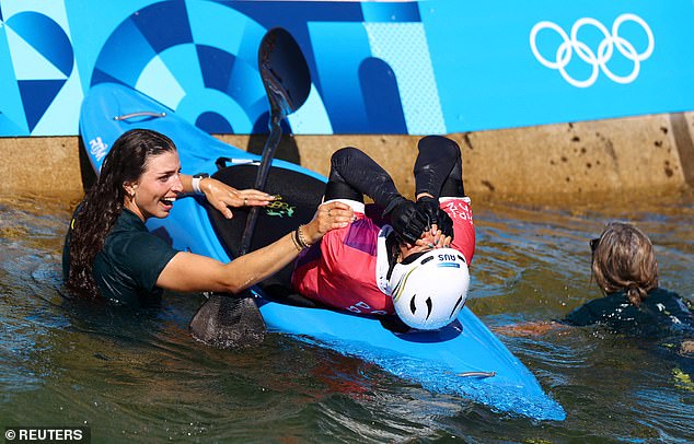 Jessica Fox is pictured after jumping into the water to celebrate Tuesday's stunning win with her sister