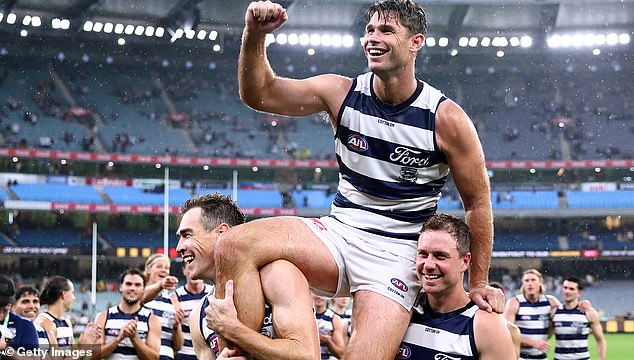 The 36-year-old has been a regular for the Geelong team since 2007 and holds the record for the most games played for the club (pictured being led off in his 350th game)