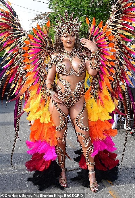 The 36-year-old singer put on a majestic show at the Crop Over Carnival in a striking outfit covered in long, colorful feathers that flowed majestically from her fit body