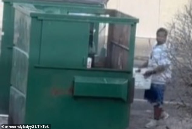 After the alleged USPS worker dumped the mail, he leaned into the dumpster and appeared to try to bury the letters under other trash