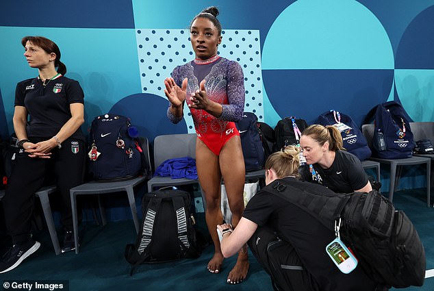 Simone Biles appeared to pull her calf muscle during her warm-up for Monday's floor final