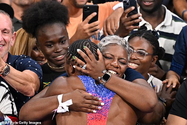 Keisha Caine Bishop (pictured embracing her son Noah after he won the gold medal in the 100-meter sprint) told Hoare not to let critics steal his joy