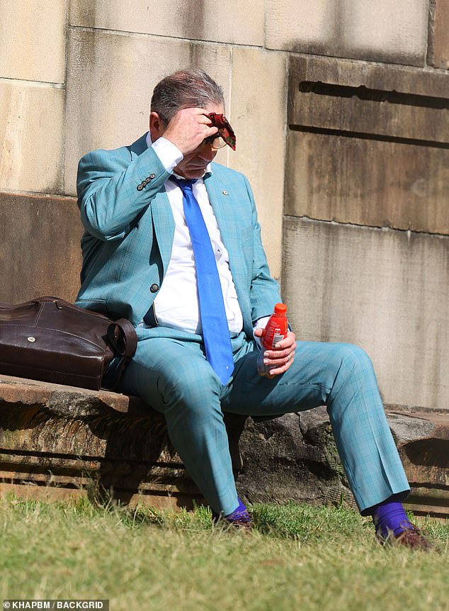 The former Chase Australia presenter, who wore a checked turquoise suit, paired with a tie and socks in different shades of blue, dabbed his sweaty forehead with a handkerchief